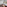 Luxury hotel room with two twin beds, dark wood floor, window, and gradient rug.