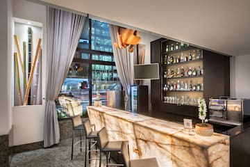 a bar with a counter and chairs