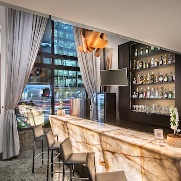 a bar with a counter and chairs