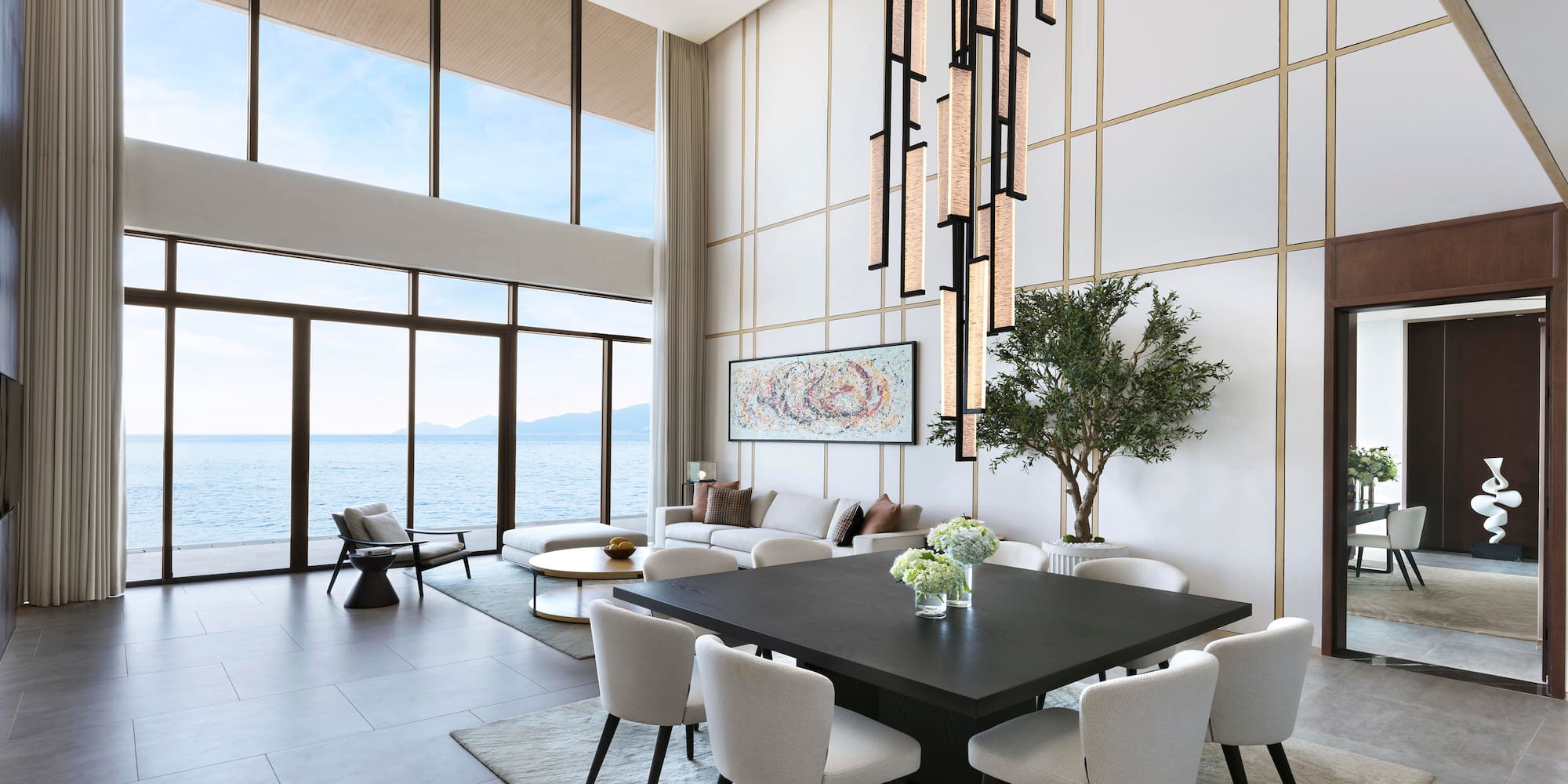 a room with a large table and chairs