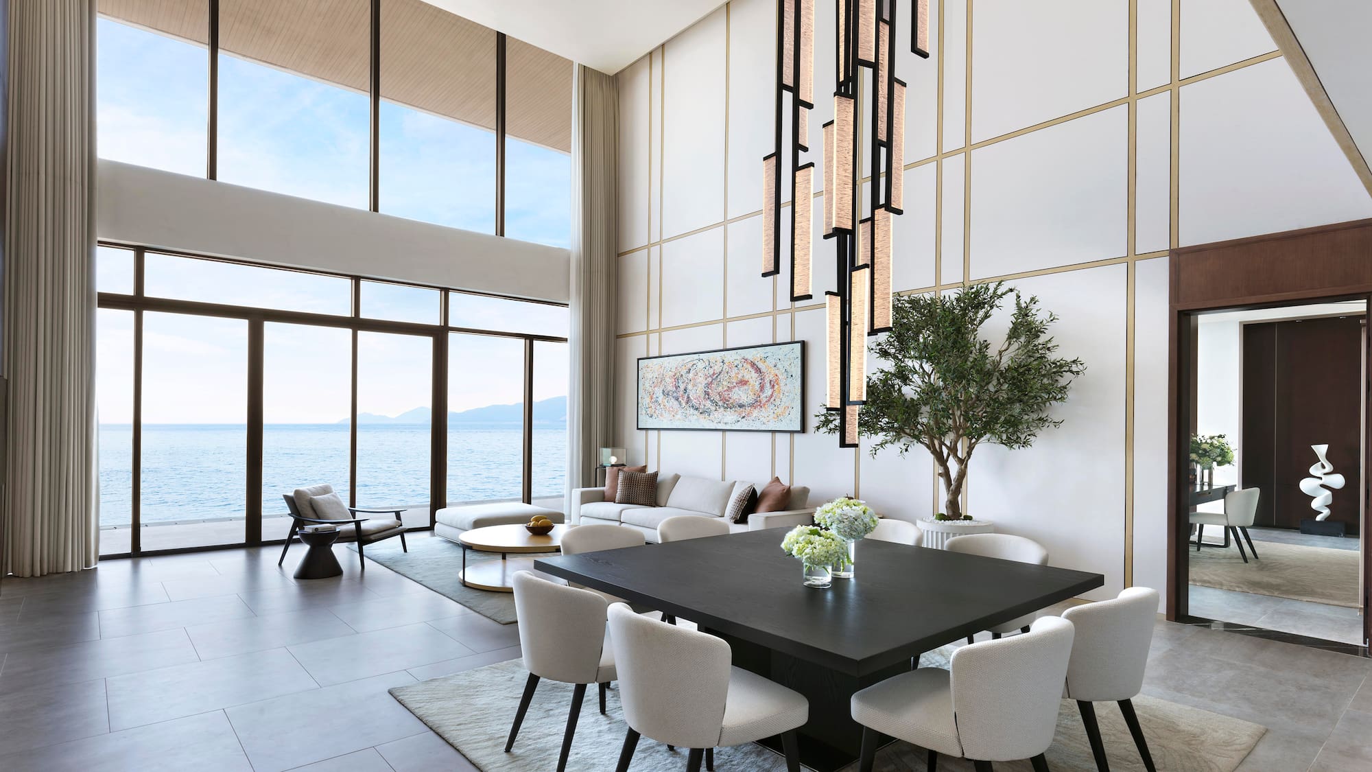 a room with a large table and chairs