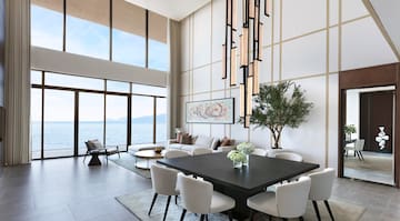 a room with a large table and chairs