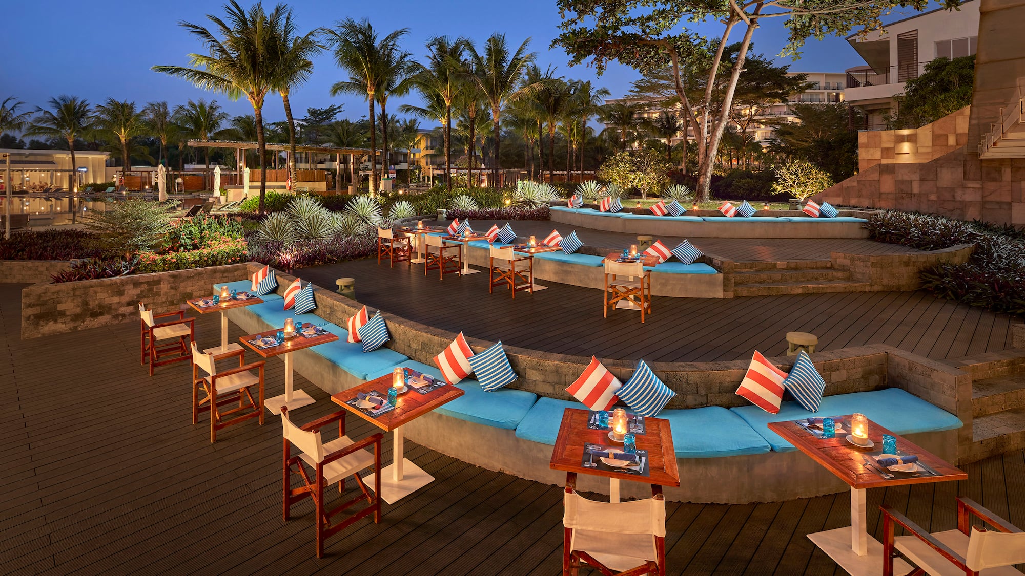 a outdoor seating area with tables and chairs