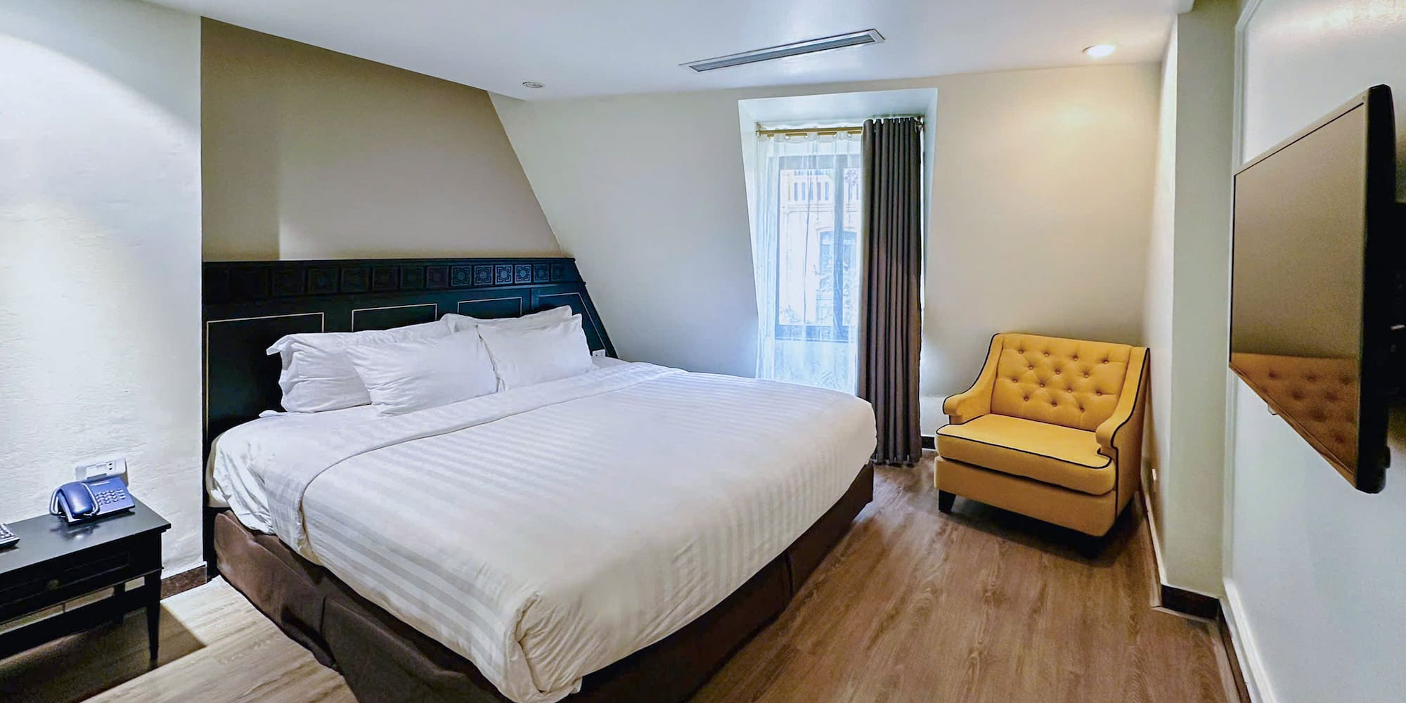 a room with a bed and a chair