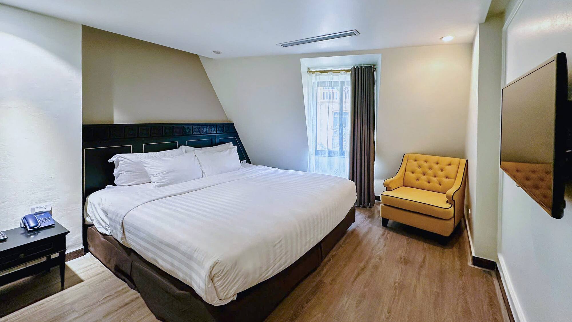 a room with a bed and a chair