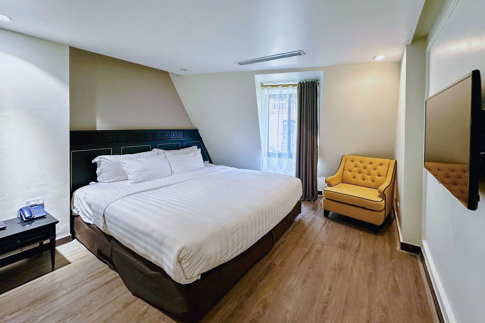 a room with a bed and a chair