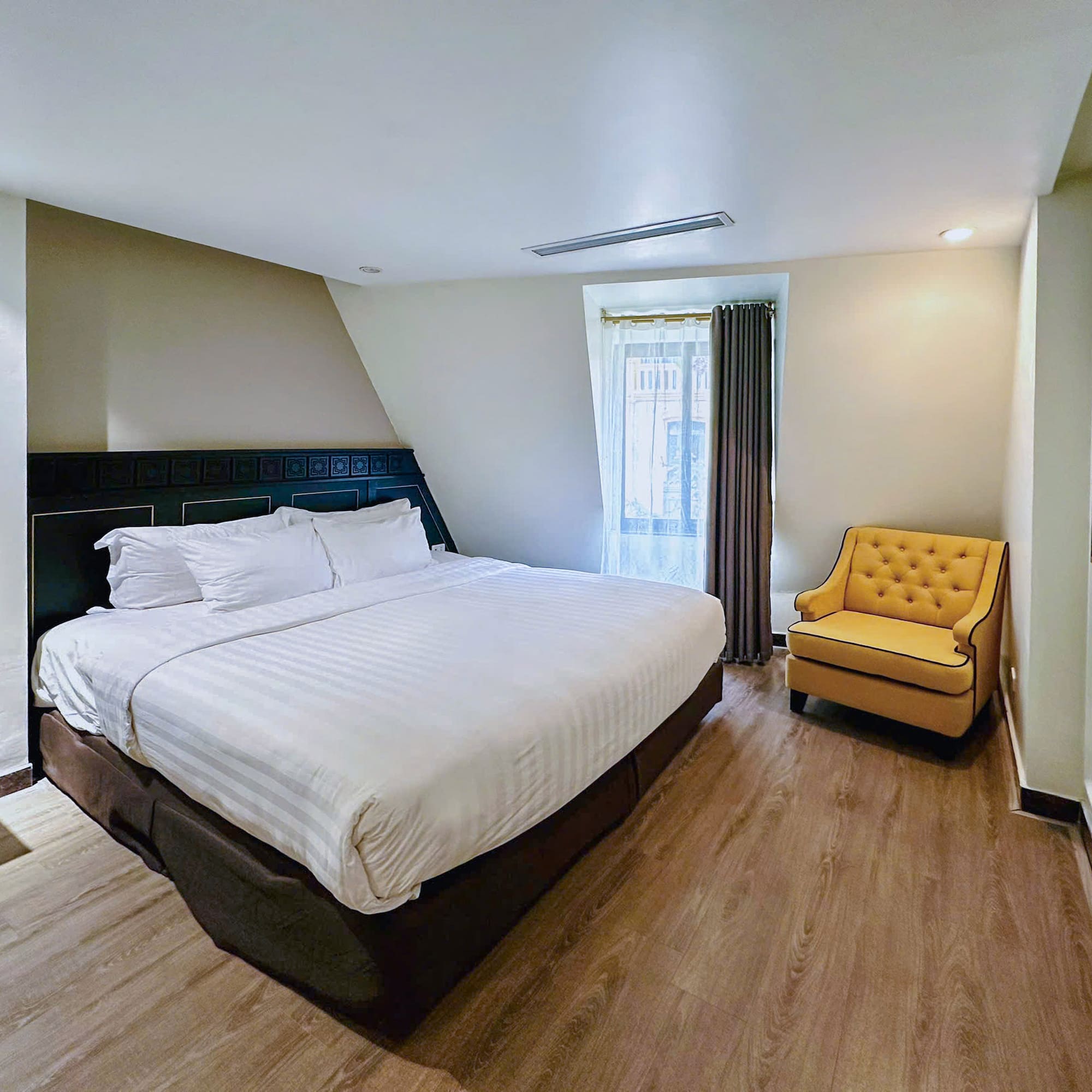 a room with a bed and a chair