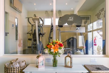 a room with a bunch of exercise equipment