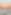 Golden sunset over ocean waves, bright sun low on the horizon.