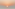 Golden sun setting over calm ocean waves and pastel sky.