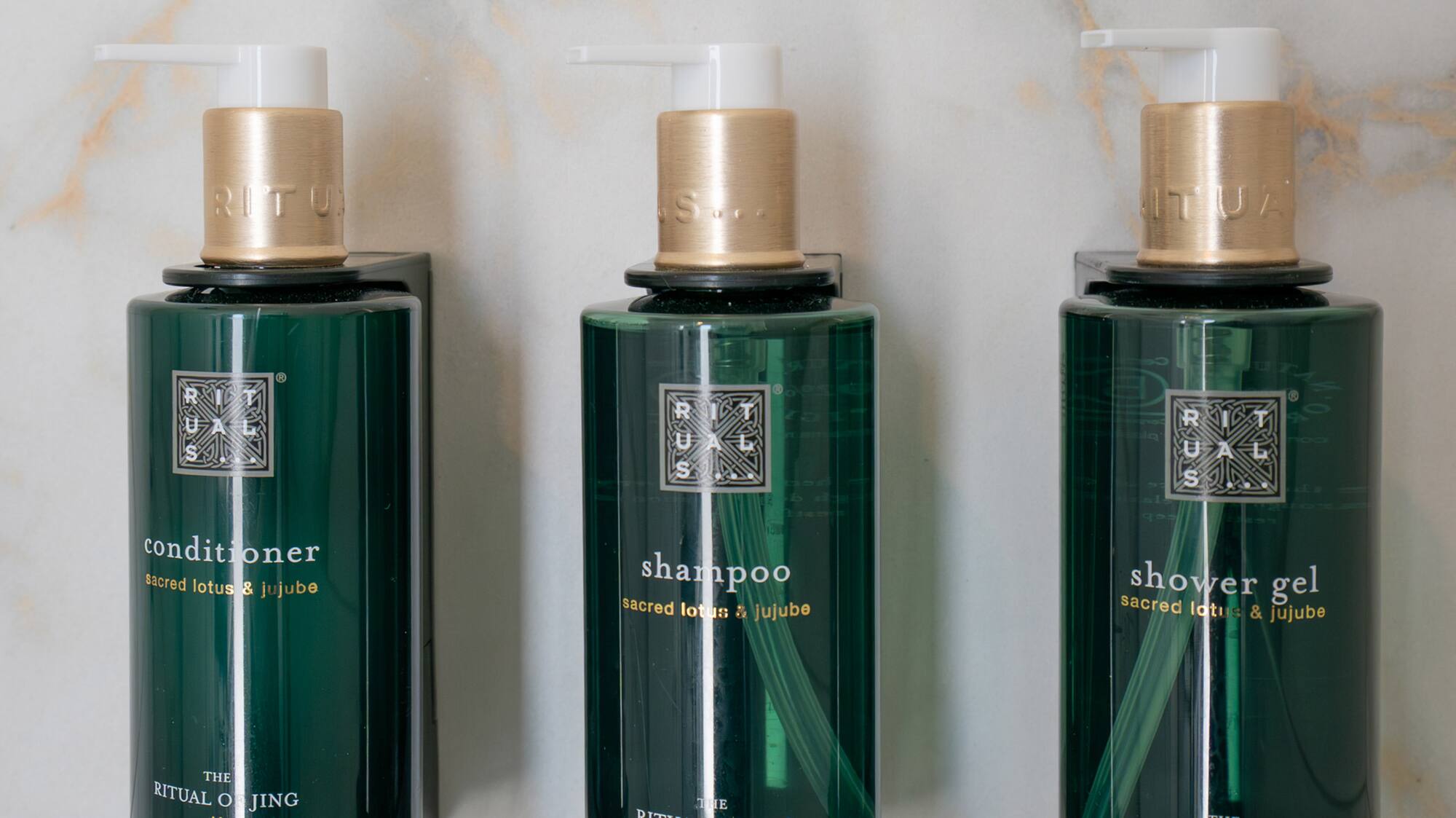 a group of green bottles with white caps