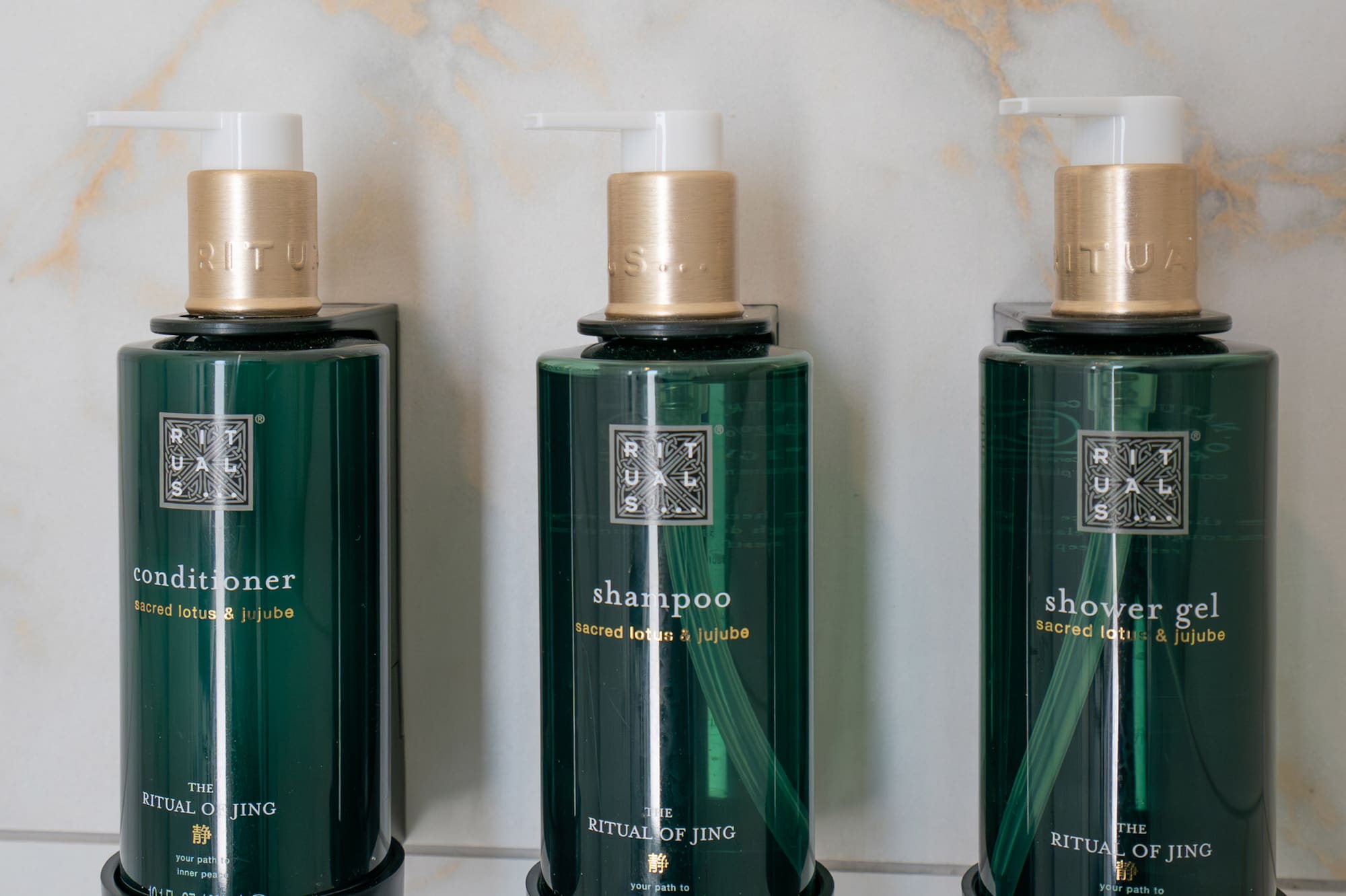 a group of green bottles with white caps