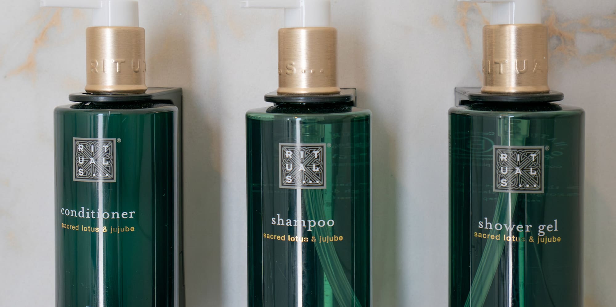 a group of green bottles with white caps