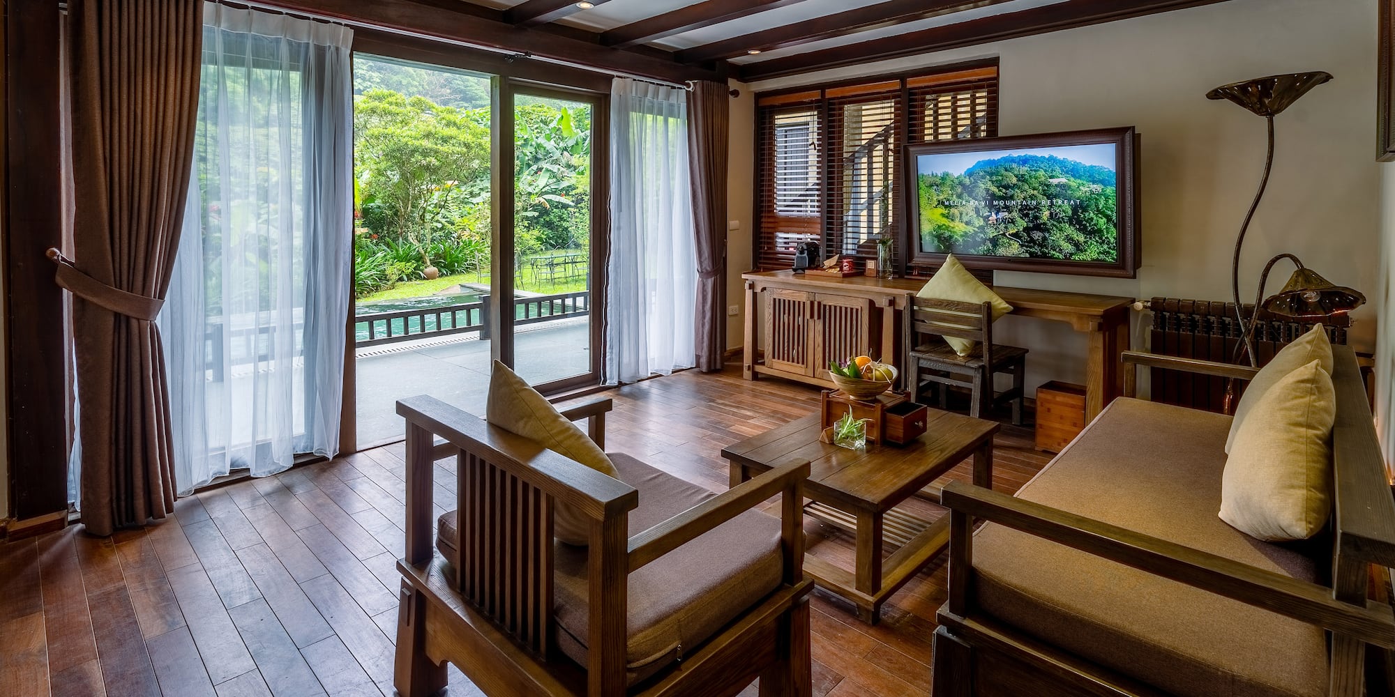 a living room with a television and a television
