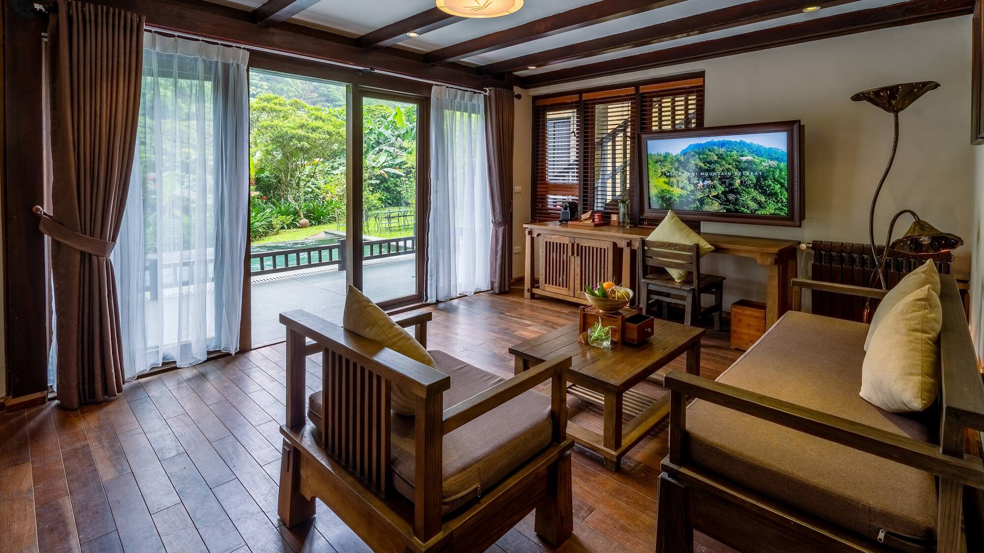 a living room with a television and a television