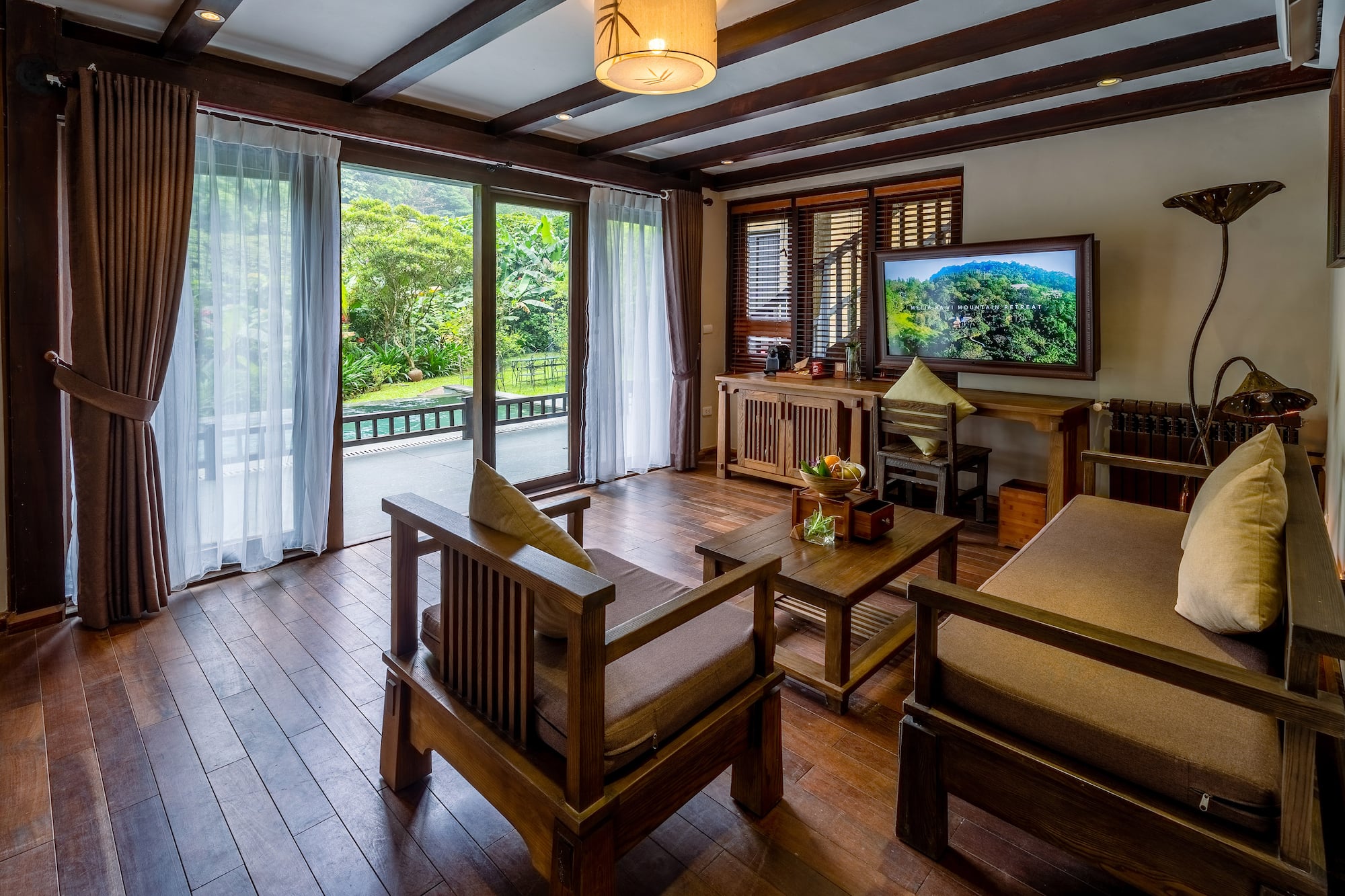 a living room with a television and a television