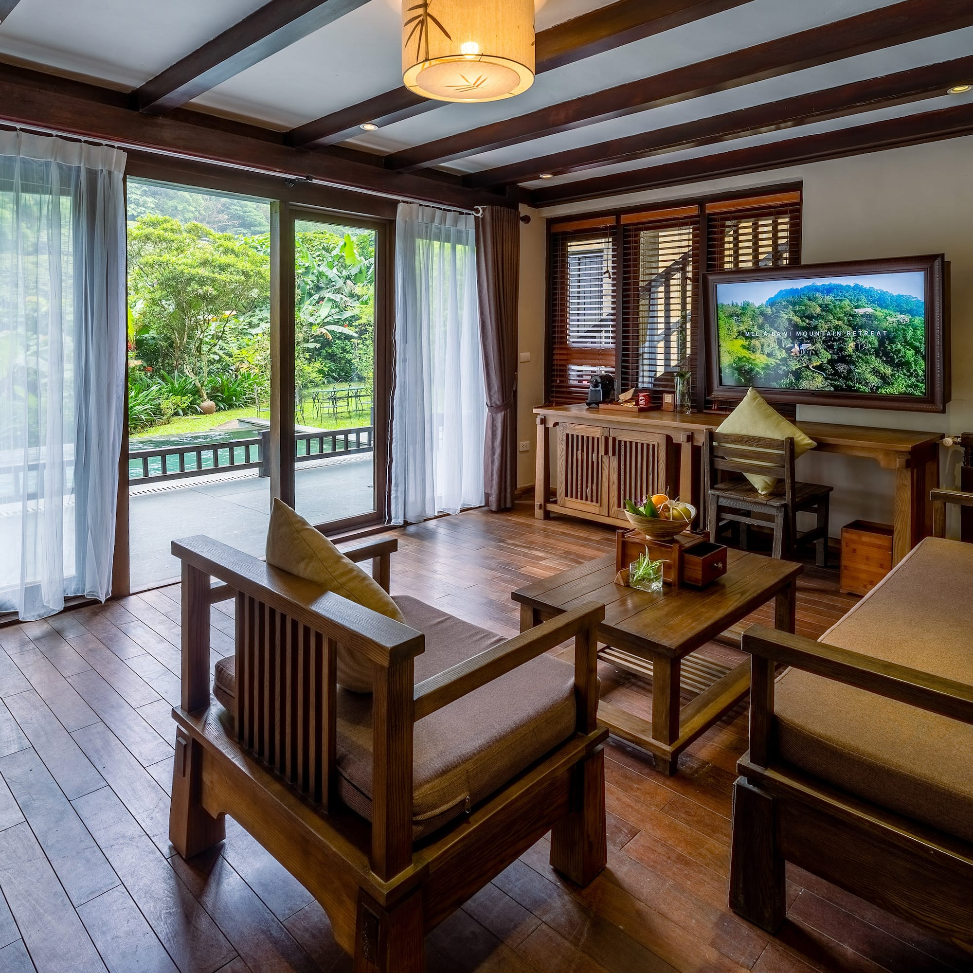a living room with a television and a television