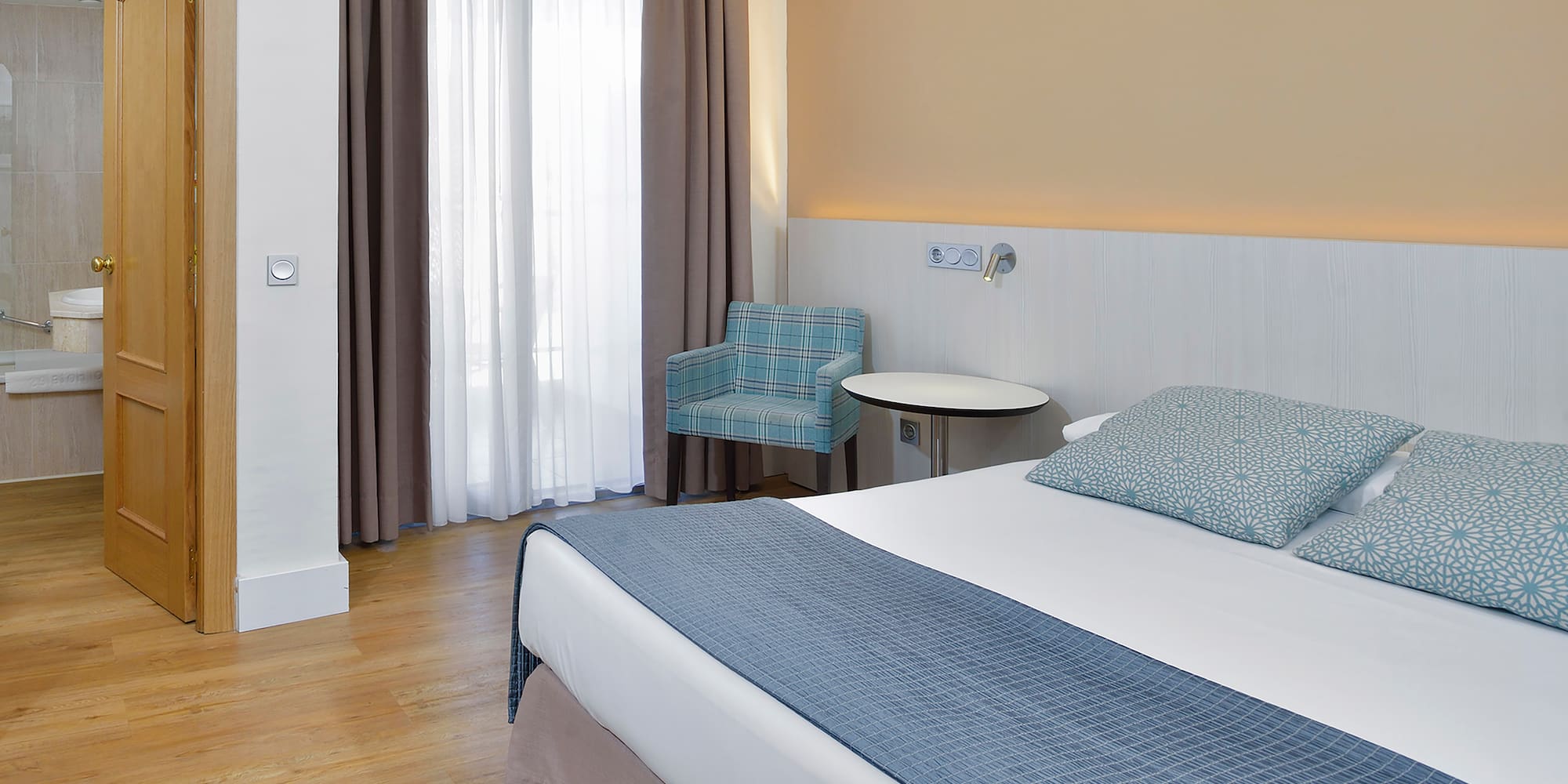 a room with a bed and a chair