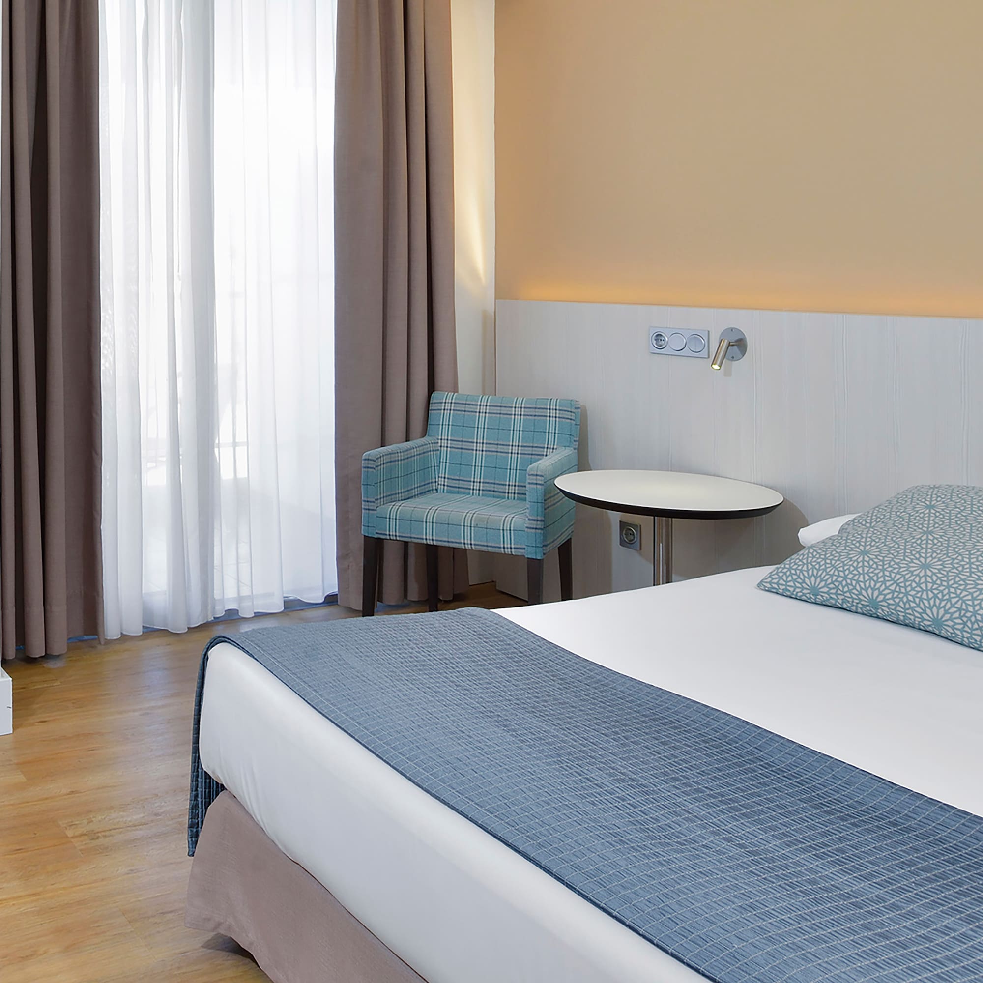 a room with a bed and a chair