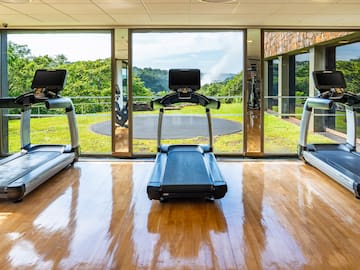a gym with treadmills and exercise equipment