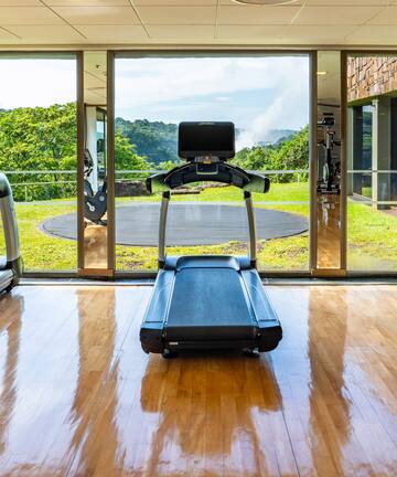 a gym with treadmills and exercise equipment