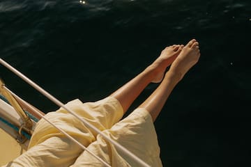 a person's legs on a boat