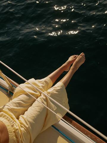 a person's legs on a boat