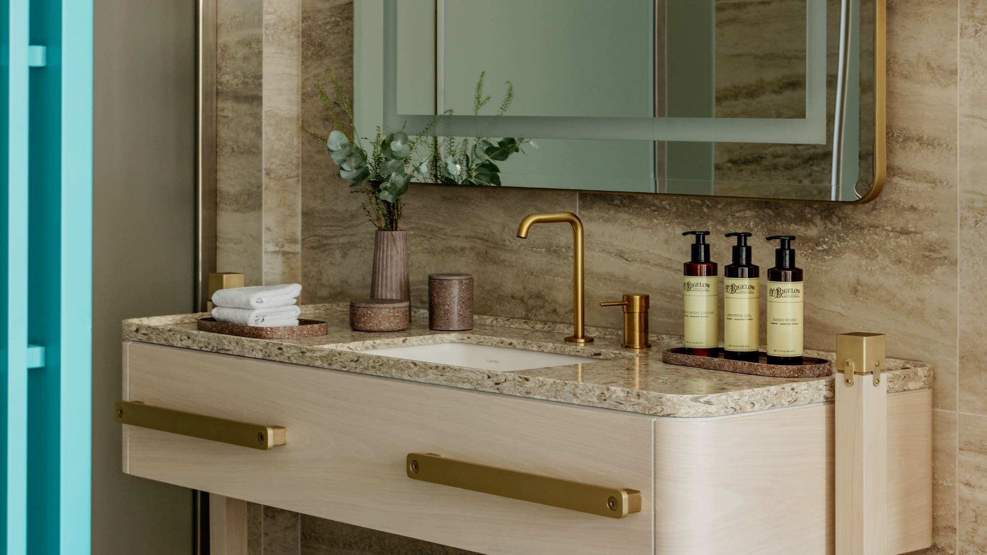 a bathroom with a mirror and sink