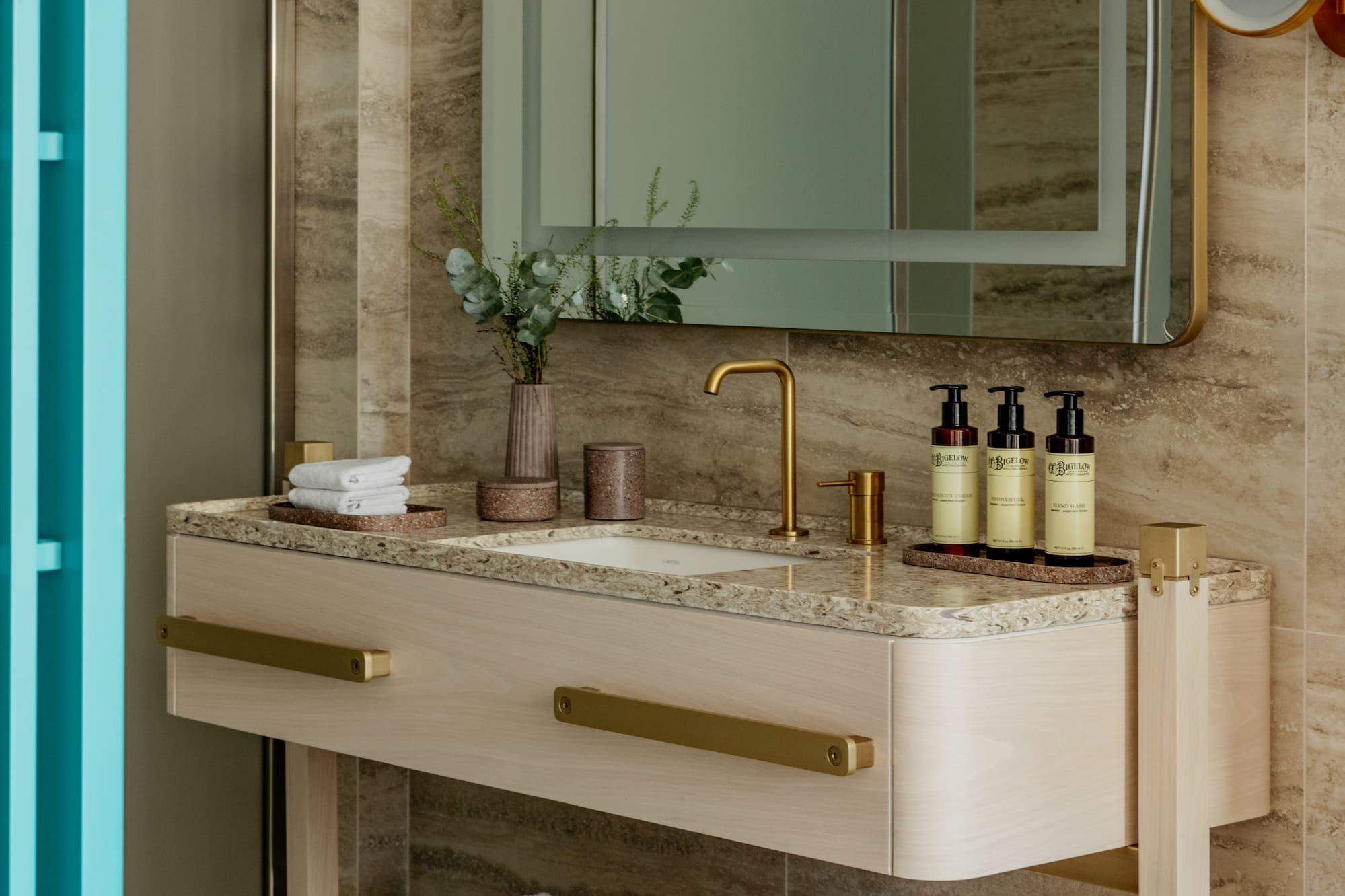 a bathroom with a mirror and sink