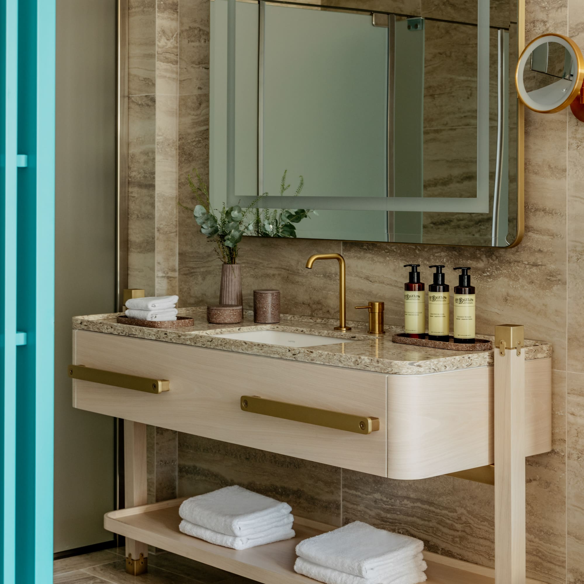 a bathroom with a mirror and sink