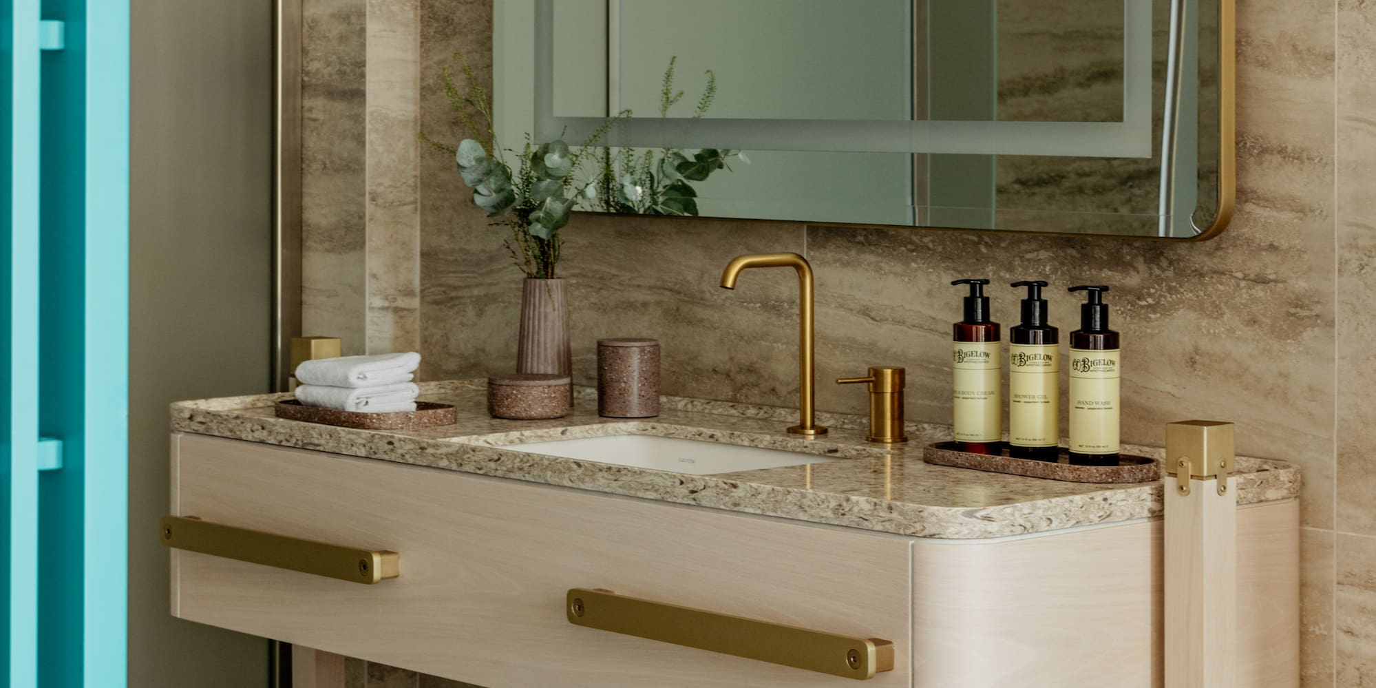 a bathroom with a mirror and sink