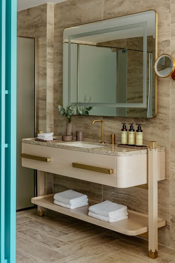 a bathroom with a mirror and sink