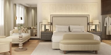 a bedroom with a bed and a mirror