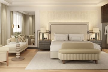 a bedroom with a bed and a mirror