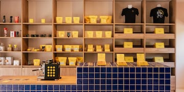 a shelf with yellow boxes on it