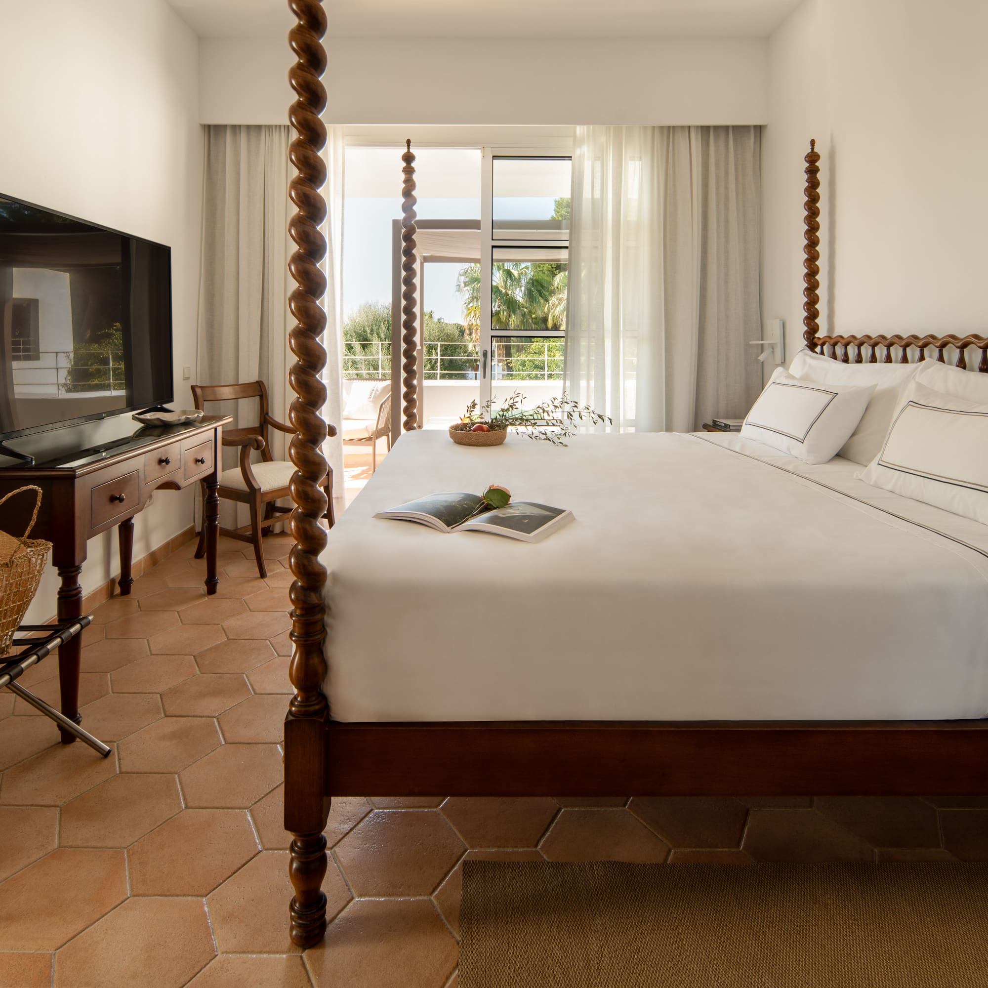 a bed with a television in a room