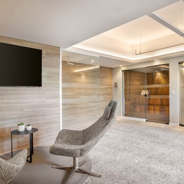 a room with a television and a chair