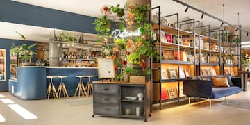 a restaurant with shelves and a bar
