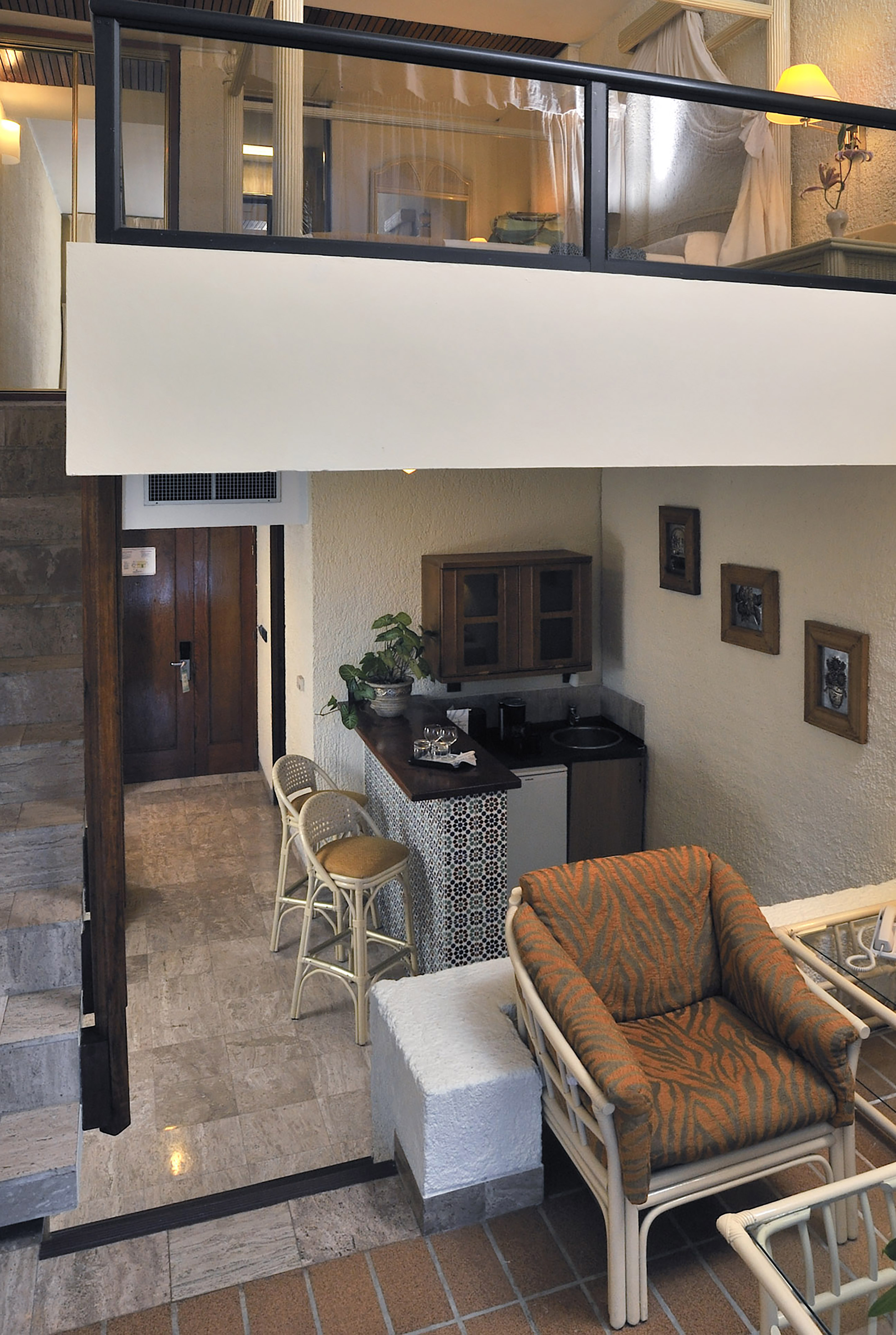 a room with a small kitchen and a small dining area