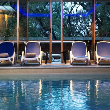 a pool with chairs and a table