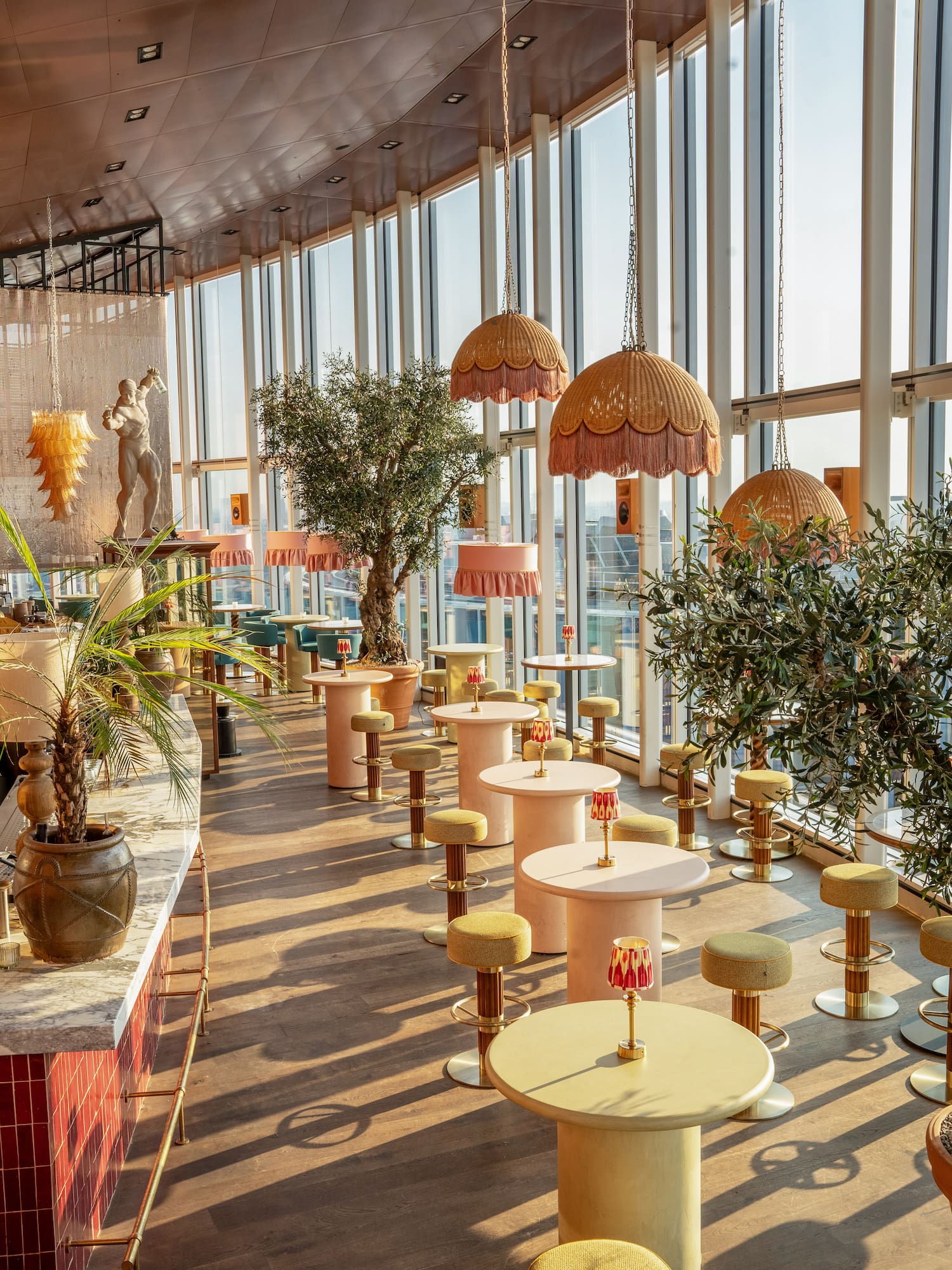 a room with tables and plants