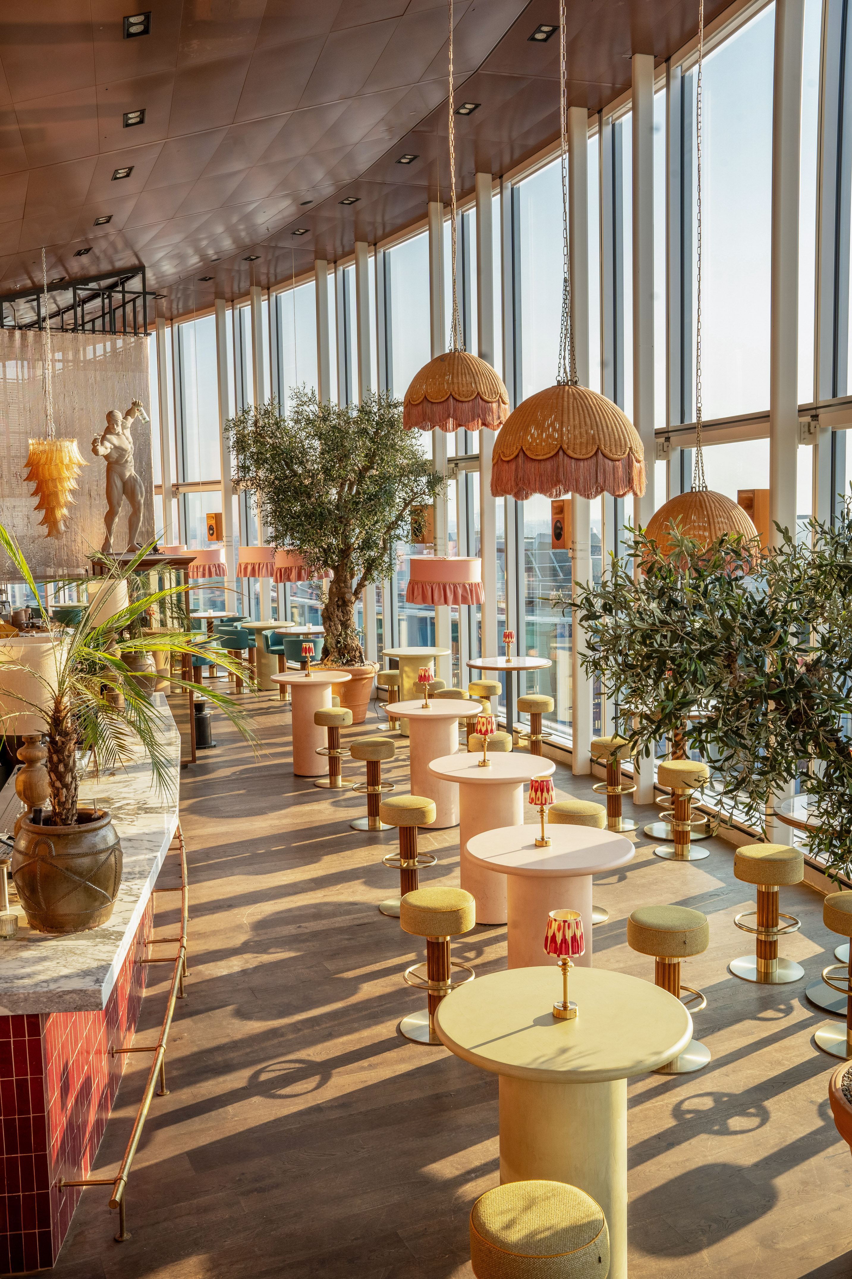 a room with tables and plants