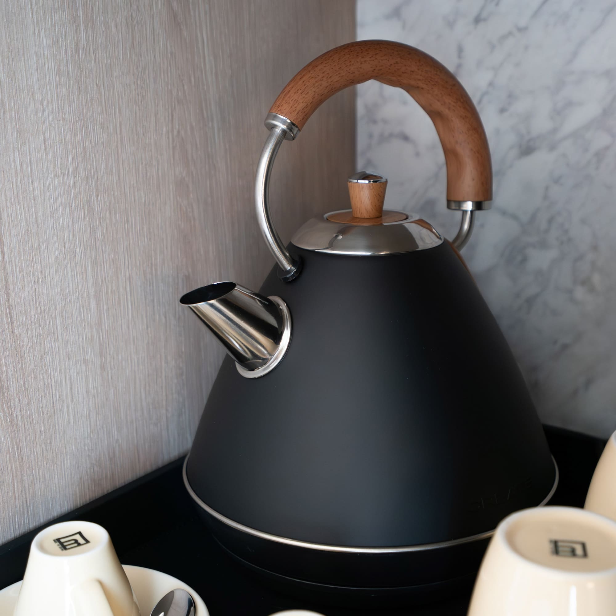 a tea kettle and cups