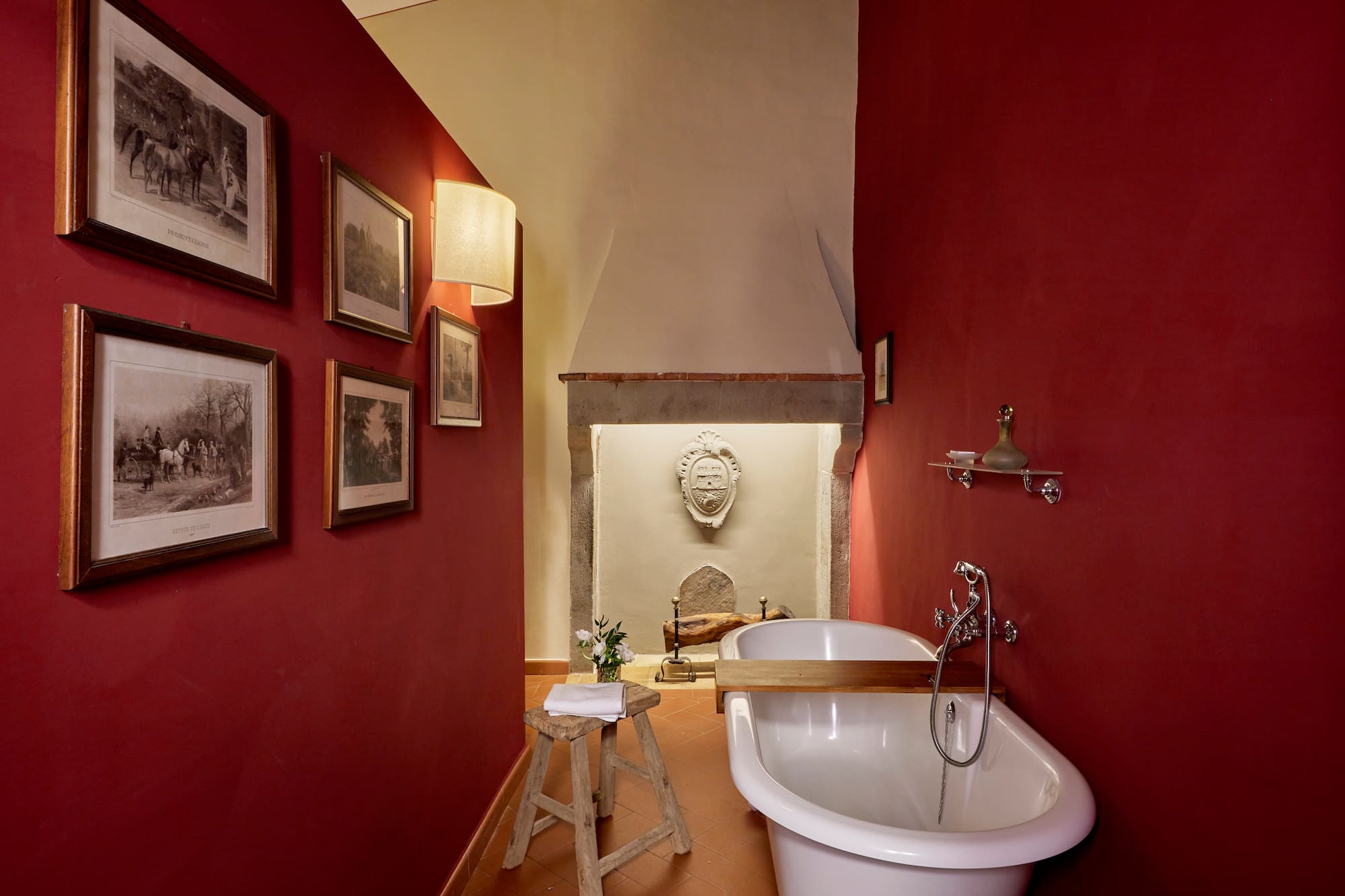 a bathroom with a tub and a stool