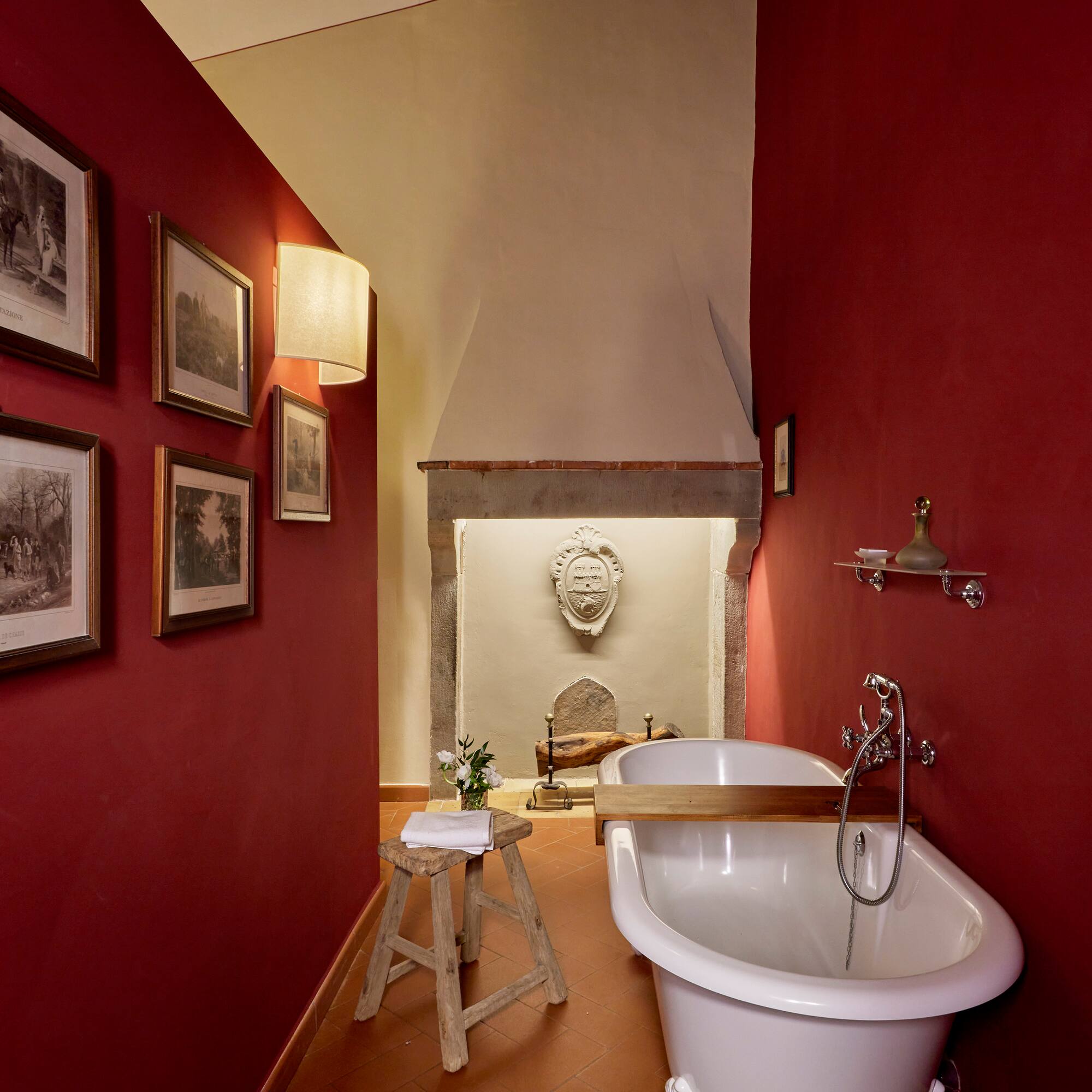 a bathroom with a tub and a stool