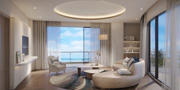 a living room with a large window and a large couch