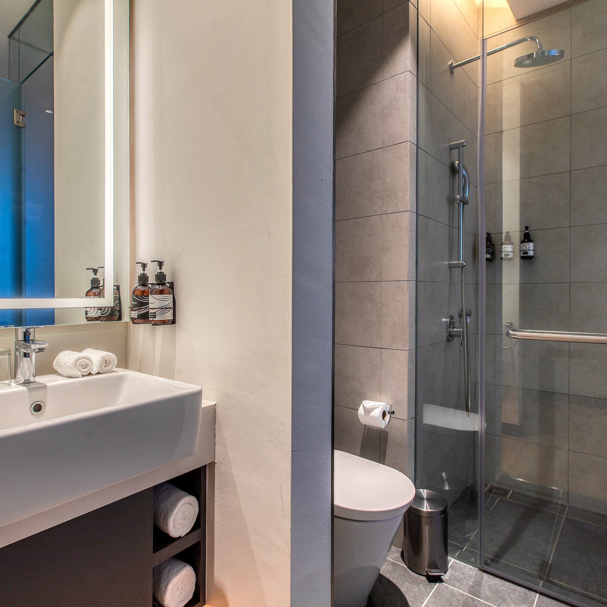 a bathroom with a shower and sink