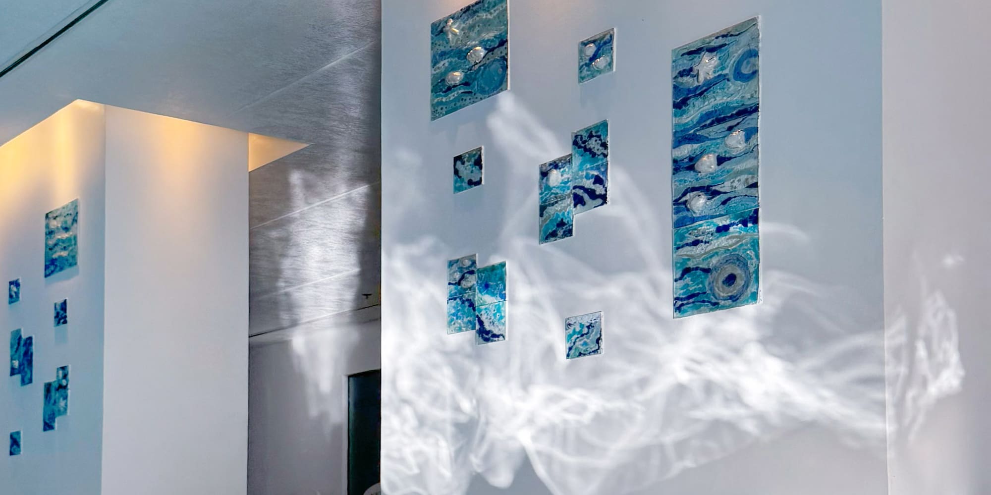 a swimming pool with art on the wall