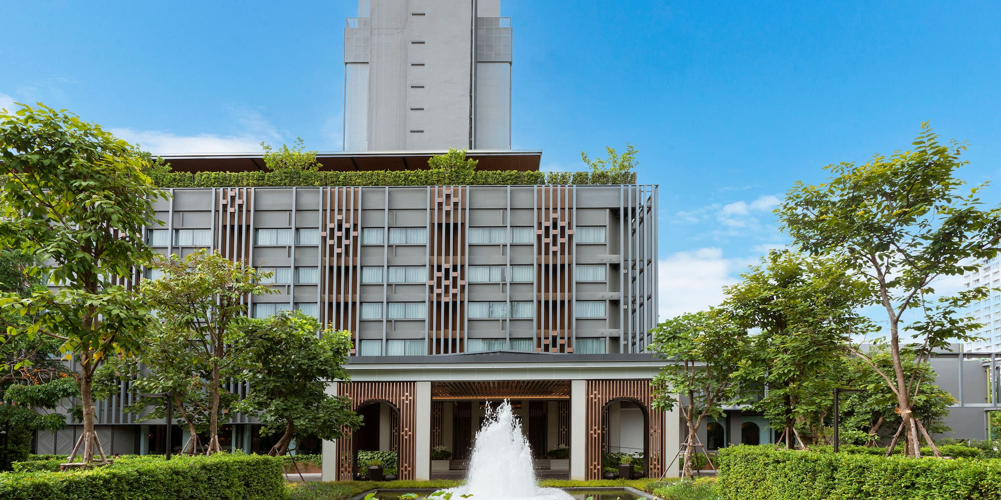 a building with a fountain in front of it