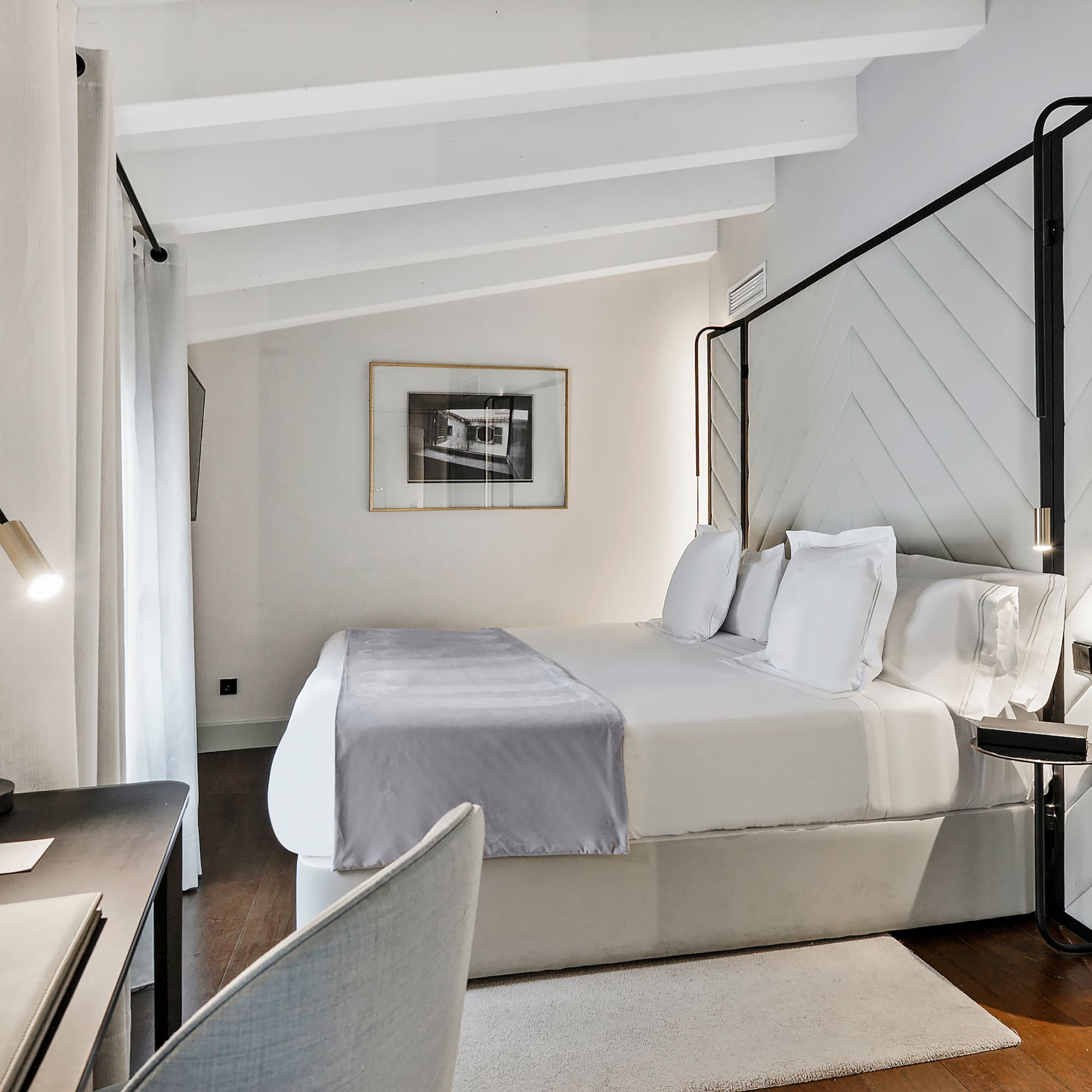 a room with a bed and a desk